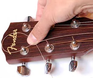 Gitaar snaren vervangen